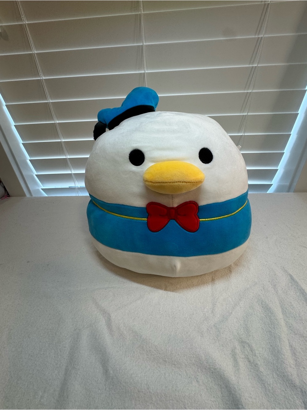 Round Sailor Donald Duck Plush with Blue Outfit and Red Bow